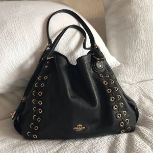 Black Leather Coach purse with gold accents
